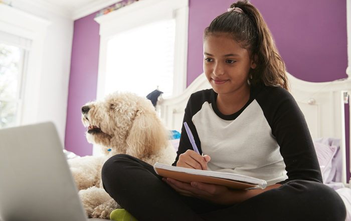 Young hispanic girl studying